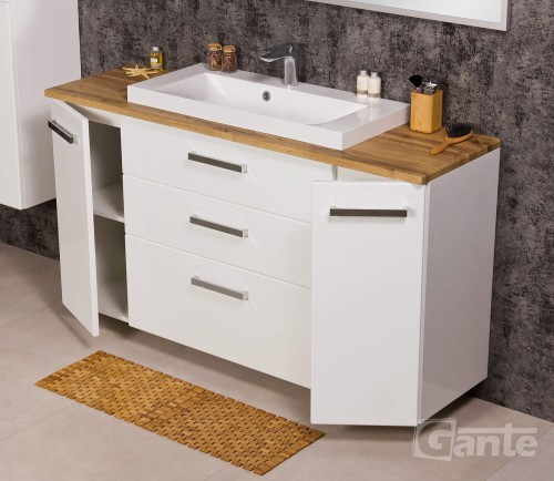 Wiszaca szafka łazienkowa z drewnianym bvlatem blatem szerokość 140 cm do tego umywalka nablatowa niska 3 szuflady po środku po bokach szafki głebokość 40 cm (5).jpg