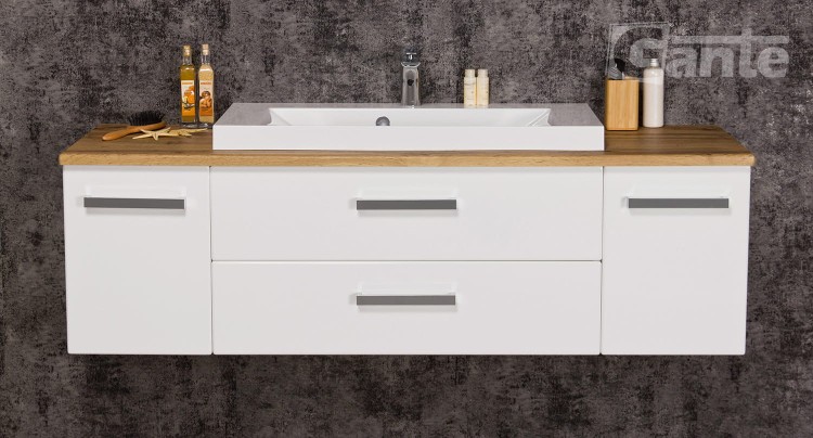 Wiszaca szafka łazienkowa z blatem w kolorze dębu szerokość 140 cm do tego umywalka nablatowa niska 2 szuflady po środku po bokach szafki głebokość 40 cm (3).jpg